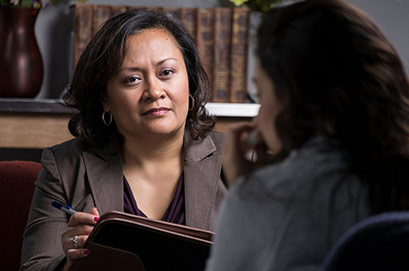 A woman working near servers