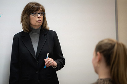 A woman working near servers